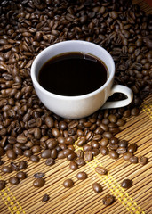 Coffee cup with roasted beans