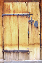 Close-up fragment of ancient door with lock- keyhole