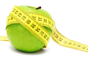 Green apple and measuring tape