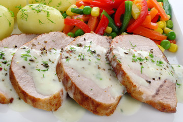 Pork meat with vegetables and sauce