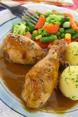 Chicken leg with vegetables and sauce