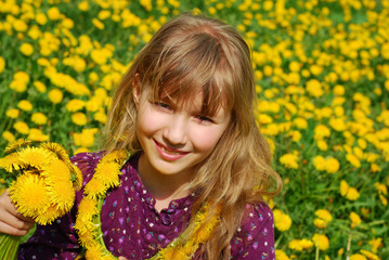 young girl with dandelions