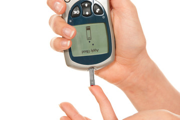 Diabetic patient measuring glucose level blood test