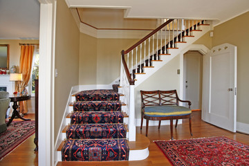 Beautiful staircase with luxury rug
