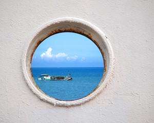 Fototapeta na wymiar Chinese Fishing Boat Seen Through a Porthole