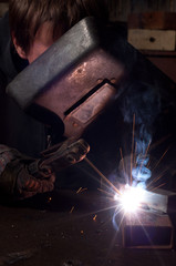 A factory welder at work