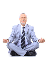 relaxed businessman meditating isolated on white