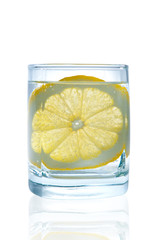 Full glass of water with lemon