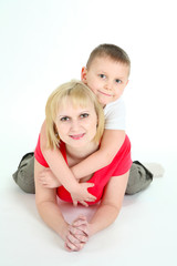 Mother and the son lie on a floor.