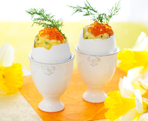 Scrambled egg with chives and red caviar