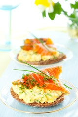 toast with scrambled eggs,salmon and chives