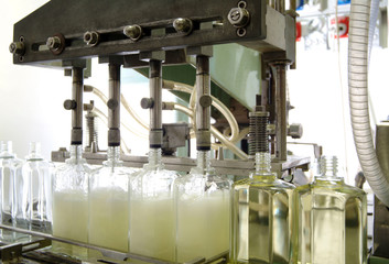 cosmetic factory, close photo of the filling machine