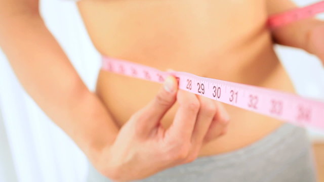 Young Female Checking Body Size Loss