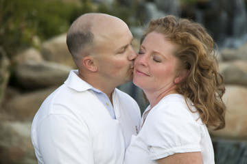 Obraz premium Attractive Couple Pose for Portrait in the Park.