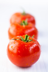 Three tomatoes in a row