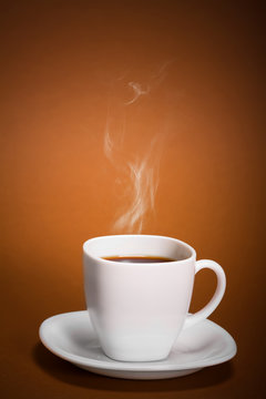White Coffee Cup on brown background