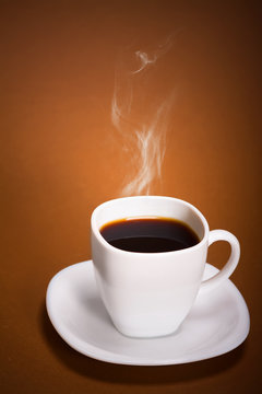 White Coffee Cup on brown background