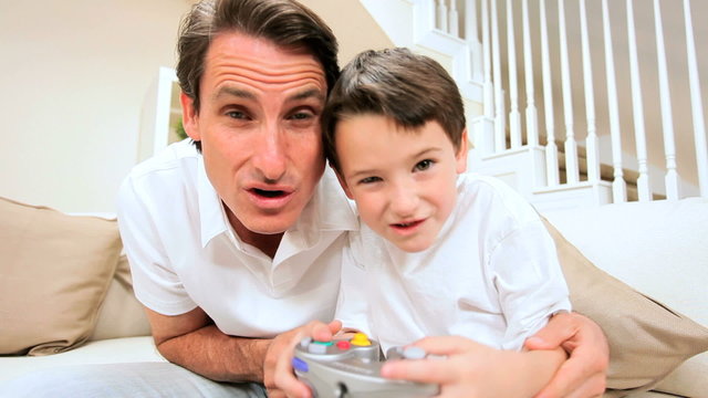 Father & Son Playing Electronic Games