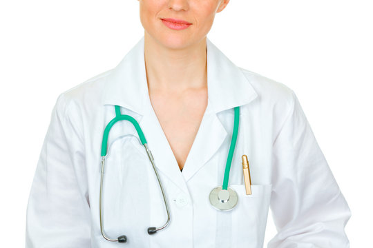 Female doctor with stethoscope isolated on white. Close-up.