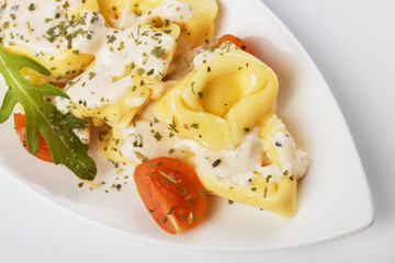 Tortellini pasta in cheese sauce