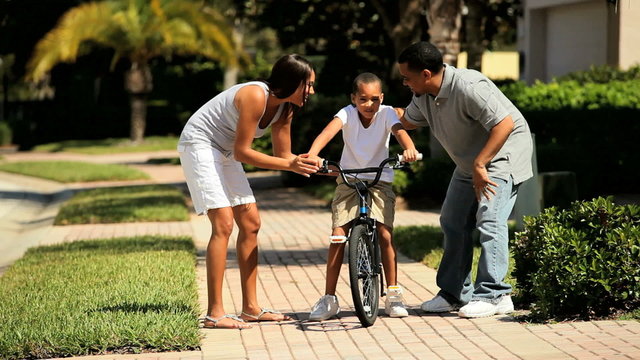 African-American Boy Learning to Ride a Bicycle