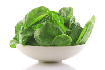 fresh spinach in a white bowl