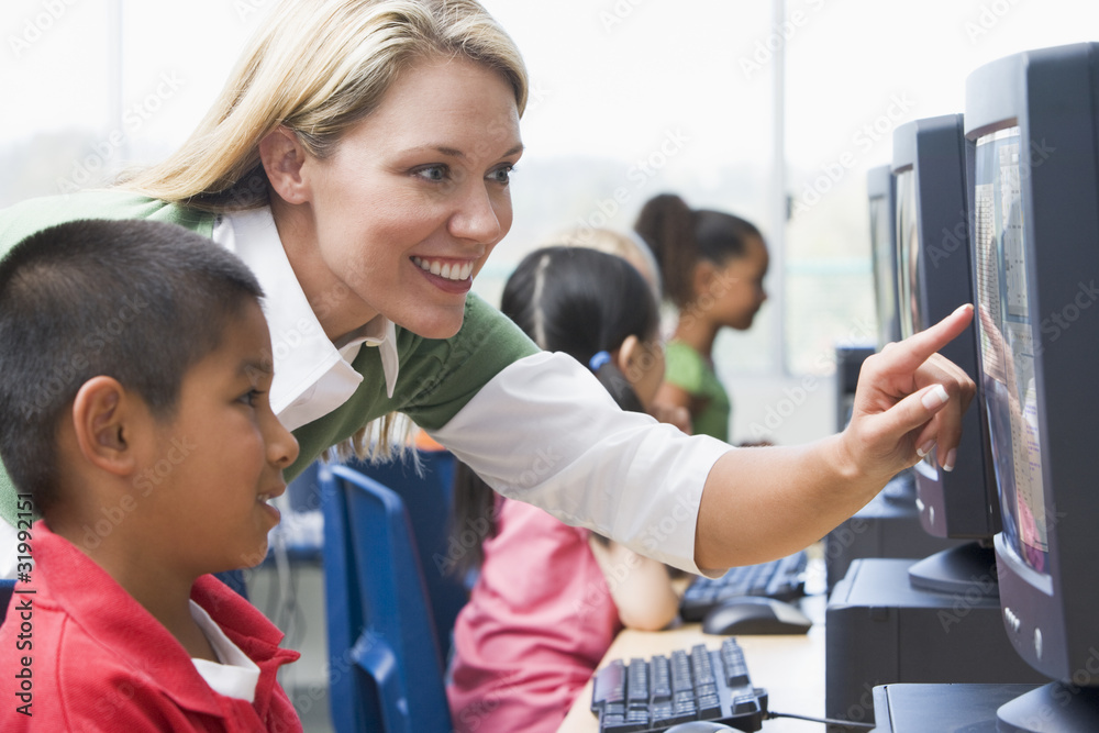 Sticker teacher helping kindergarten children learn how to use computers