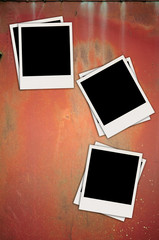 Three Blank Photos on Metal Background