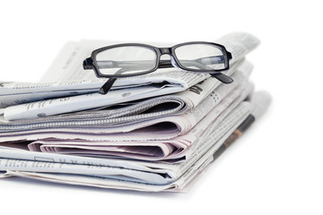 Newspapers and black glasses