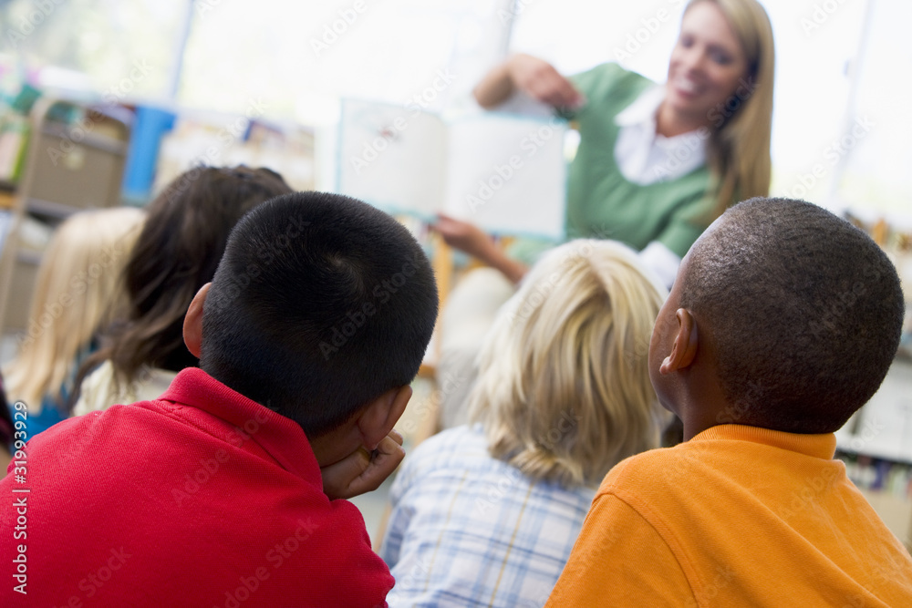 Sticker kindergarten teacher reading to children in library