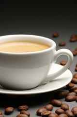 Cup of coffee and coffee beans