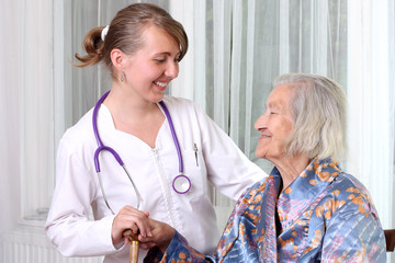 Senior woman being visited by a doctor
