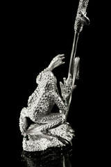 Silver sculpture of a frog