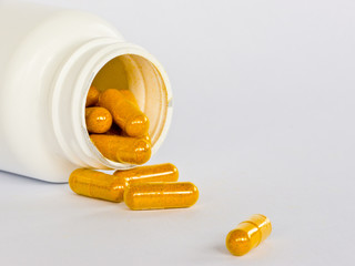 Yellow Capsules and White Bottle