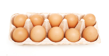 yellow eggs and one white one in a package