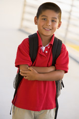 Portrait of kindergarten boy with backpack