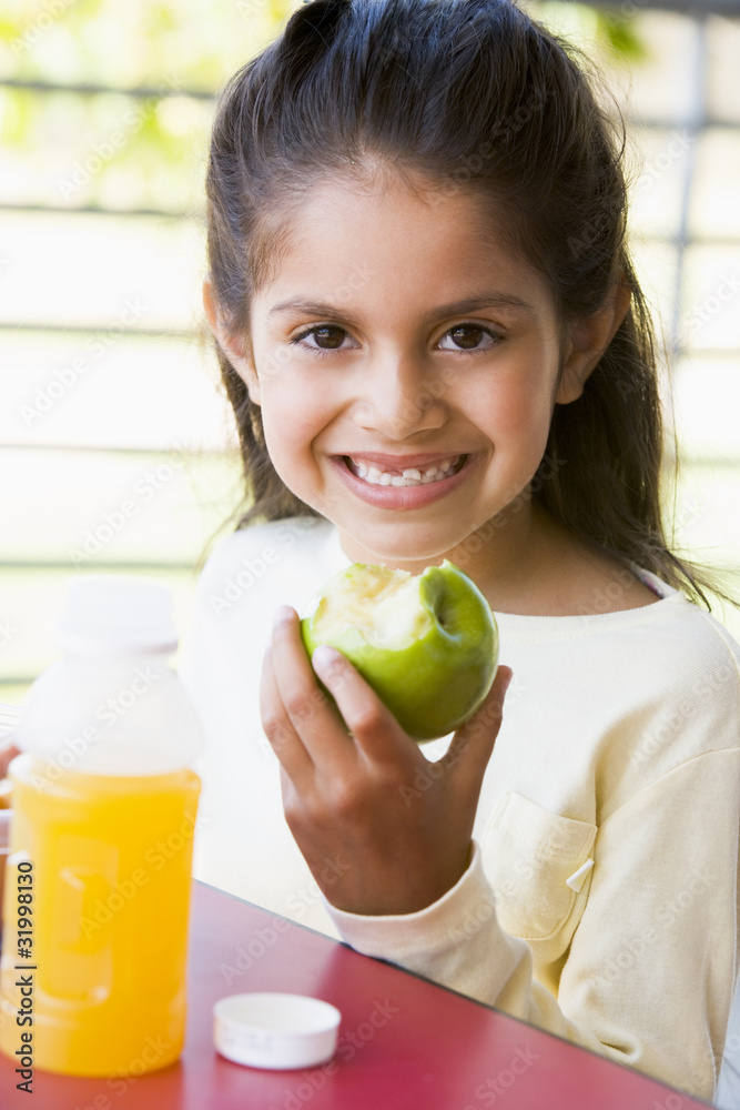 Canvas Prints girl eating lunch at kindergarten