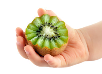 child holds kiwi in hand