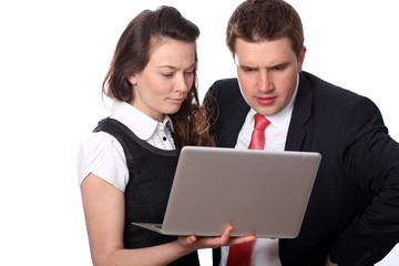 Closeup of a happy casual couple looking at laptop