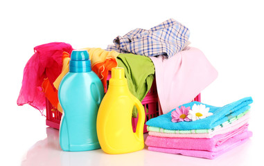 Colorful towels and liquid laundry detergent   over white backgr
