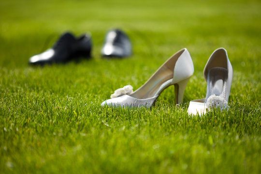 Wedding Shoes In The Grass Field