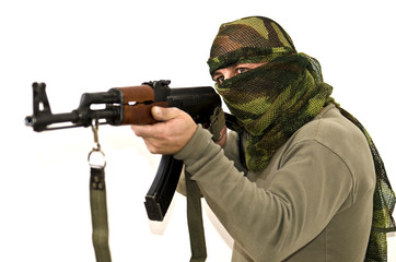Man in scarf with gun against white background