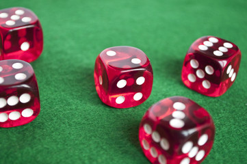 Set of gambling dices on green background