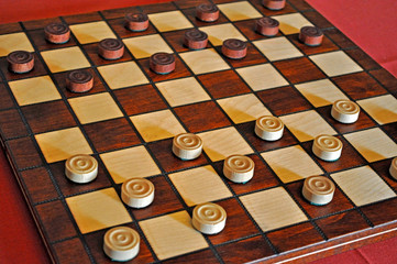 A Classic Checkers set made of Wood.