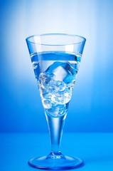 Water in the glass against gradient background