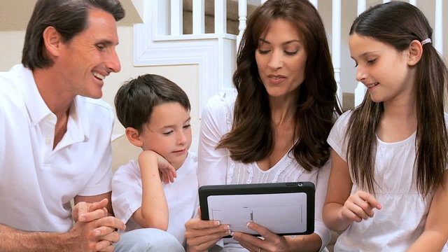 Caucasian Family Using Wireless Tablet