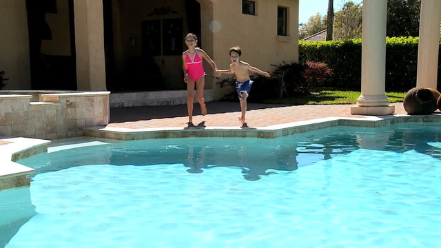 Young Siblings in Family Swimming Pool