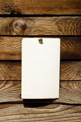 Blank note on wooden wall