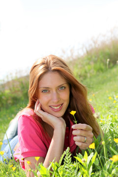 Beautiful woman laying down in park