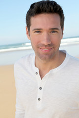 Portrait of handsome man at the beach